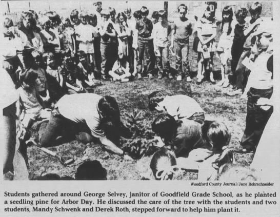 Students gathered as George Selvey planted tree